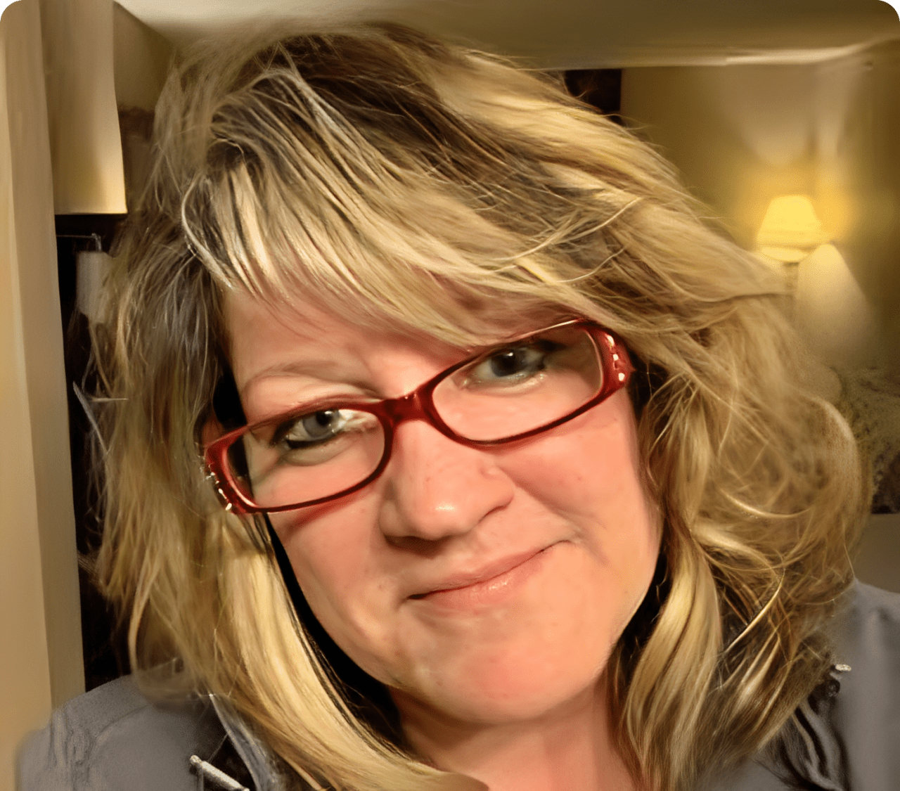 Smiling woman with red glasses