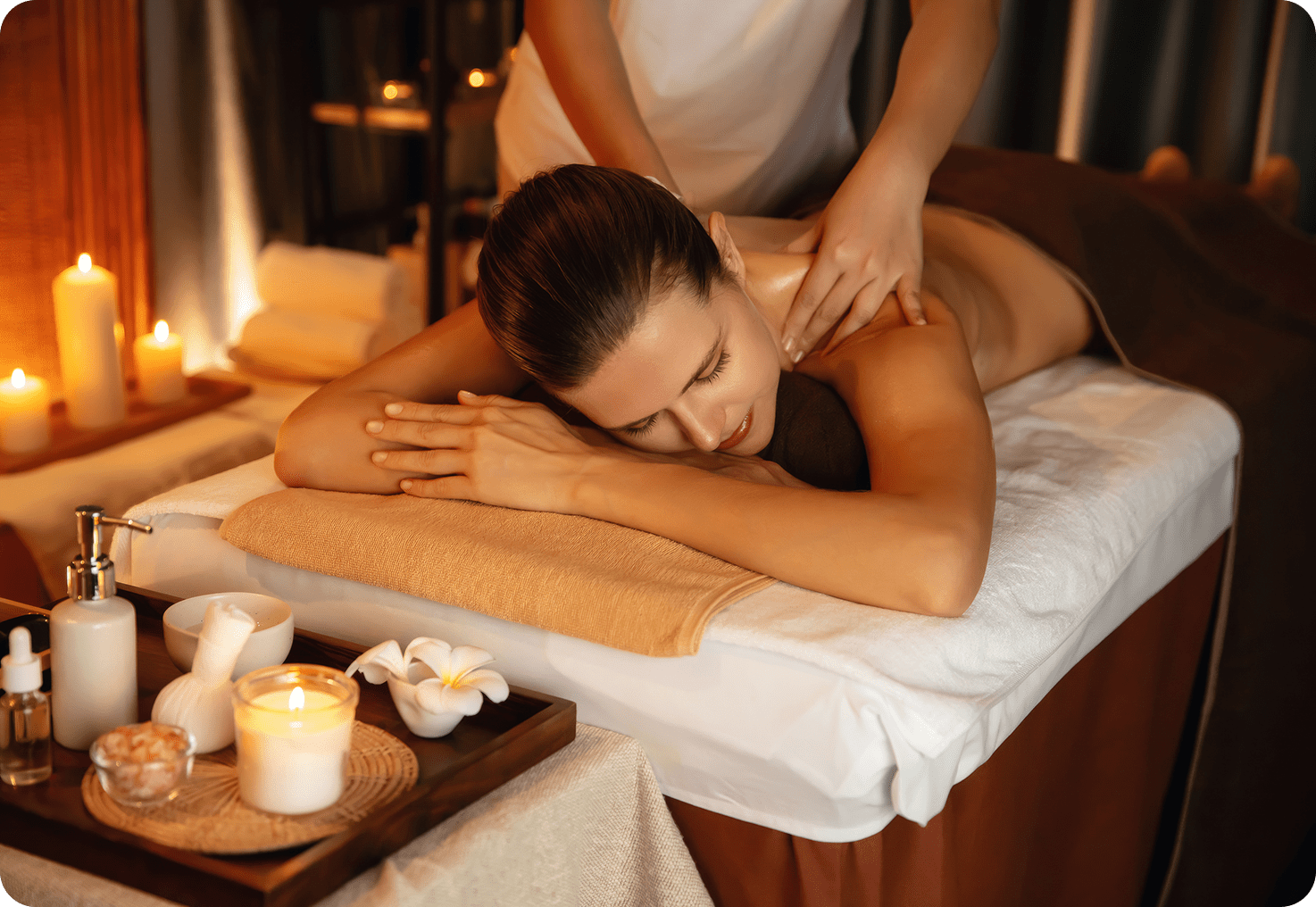 Woman receiving relaxing massage in spa