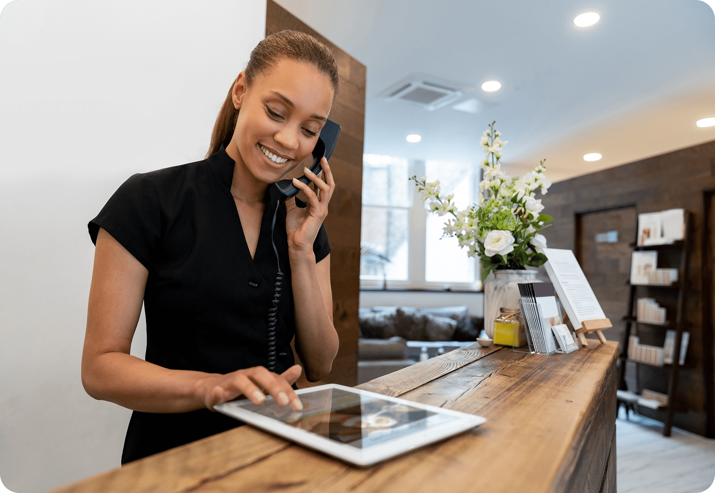Smiling receptionist at front desk
