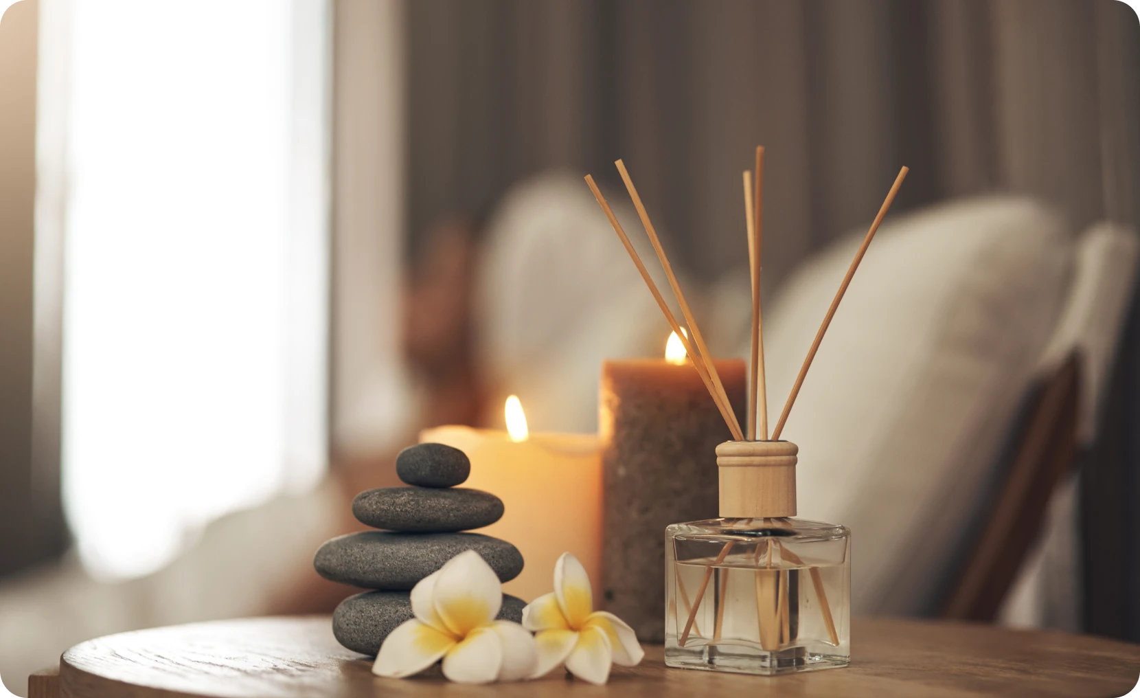 Aromatherapy scene with candles and plumeria